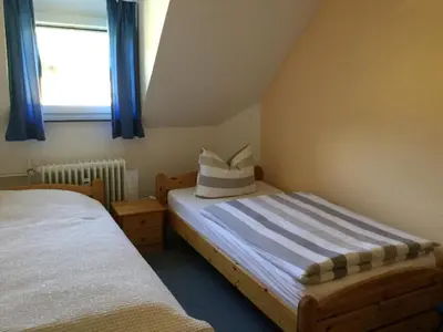 Ein Bett oder Betten in einem Zimmer der Unterkunft Pension Graef