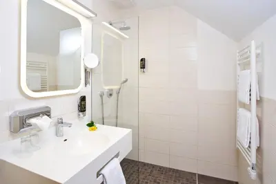 Ein Badezimmer in der Unterkunft Vulkanhotel balance&selfness ***S