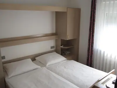 Ein Bett oder Betten in einem Zimmer der Unterkunft Hotel Maifelder Hof