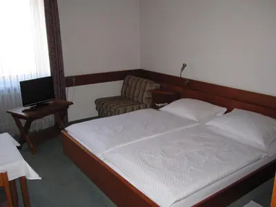 Ein Bett oder Betten in einem Zimmer der Unterkunft Hotel Maifelder Hof