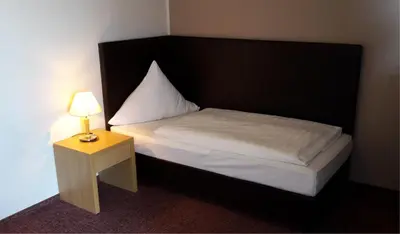 Ein Bett oder Betten in einem Zimmer der Unterkunft Pension Haus Anny