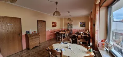 Ein Sitzbereich in der Unterkunft Hotel - Pension Wendland