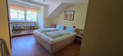 Ein Bett oder Betten in einem Zimmer der Unterkunft Hotel - Pension Wendland