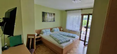 Ein Bett oder Betten in einem Zimmer der Unterkunft Hotel - Pension Wendland