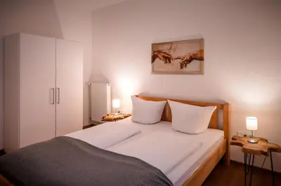 Ein Bett oder Betten in einem Zimmer der Unterkunft Ferienwohnungen Reinhilde