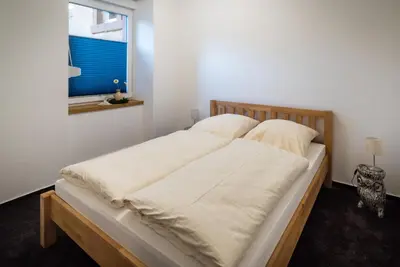 Ein Bett oder Betten in einem Zimmer der Unterkunft Ferienwohnungen Reinhilde