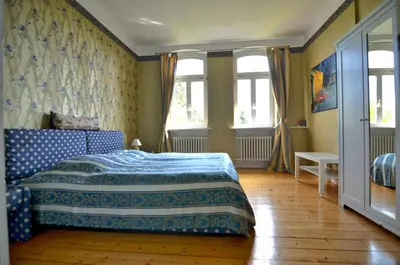Ein Bett oder Betten in einem Zimmer der Unterkunft Altes Pfarrhaus Gondershausen