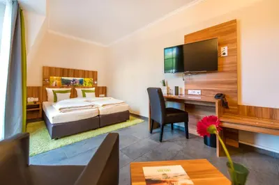 Ein Bett oder Betten in einem Zimmer der Unterkunft Hotel Cochemer Jung