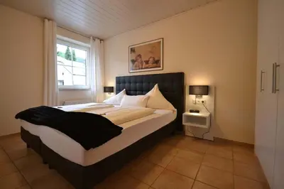 Ein Bett oder Betten in einem Zimmer der Unterkunft Ferienwohnung Mama Mosel