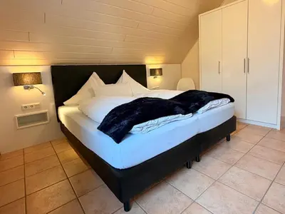 Ein Bett oder Betten in einem Zimmer der Unterkunft Ferienwohnung Mama Mosel