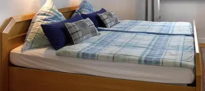 Ein Bett oder Betten in einem Zimmer der Unterkunft Pension 
