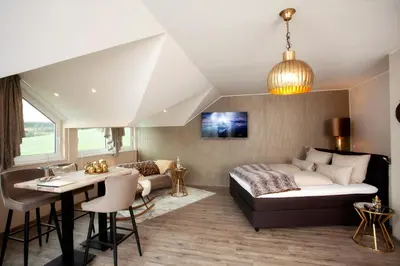 Ein Sitzbereich in der Unterkunft Das Landhaus Apartments