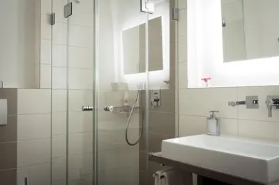 Ein Badezimmer in der Unterkunft Das Landhaus Apartments