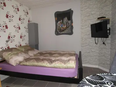 Ein Bett oder Betten in einem Zimmer der Unterkunft Ferienapartments am Dorfplatz