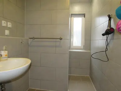 Ein Badezimmer in der Unterkunft Ferienapartments am Dorfplatz