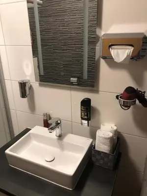 Ein Badezimmer in der Unterkunft Hotel am Brünnchen