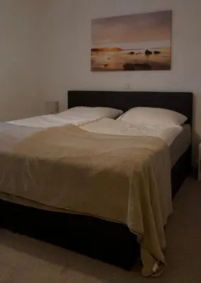 Ein Bett oder Betten in einem Zimmer der Unterkunft Ferienwohnung Röschen
