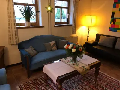 Ein Sitzbereich in der Unterkunft Hommes Haus