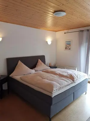 Ein Bett oder Betten in einem Zimmer der Unterkunft Ferienwohnung Morbach