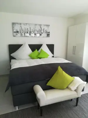 Ein Bett oder Betten in einem Zimmer der Unterkunft Ferienwohnungen Christina