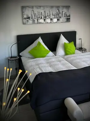 Ein Bett oder Betten in einem Zimmer der Unterkunft Ferienwohnungen Christina