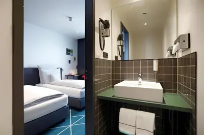 Ein Bett oder Betten in einem Zimmer der Unterkunft sander Hotel