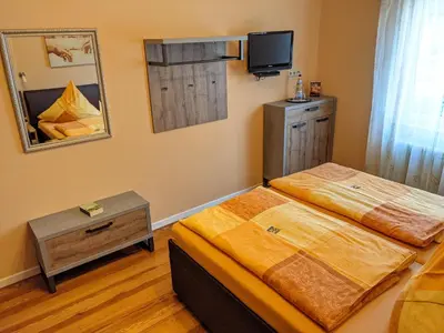 Ein Bett oder Betten in einem Zimmer der Unterkunft Gaestehaus Gaes