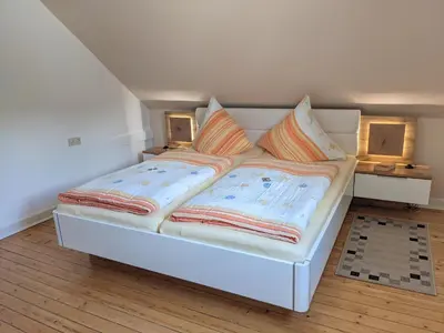 Ein Bett oder Betten in einem Zimmer der Unterkunft Gaestehaus Gaes