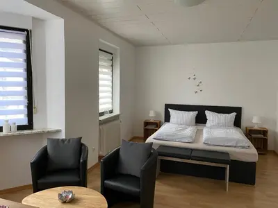 Ein Bett oder Betten in einem Zimmer der Unterkunft Ferienwohnungen Fuhrmann-Burg