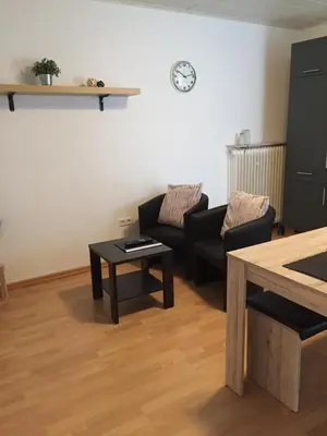 Ein Sitzbereich in der Unterkunft Ferienwohnungen Fuhrmann-Burg