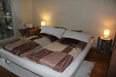 Ein Bett oder Betten in einem Zimmer der Unterkunft Ferienwohnung-malanders
