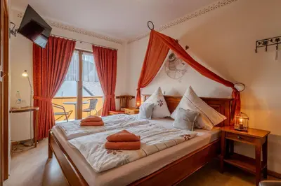 Ein Bett oder Betten in einem Zimmer der Unterkunft Hotel Am Eifelsteig