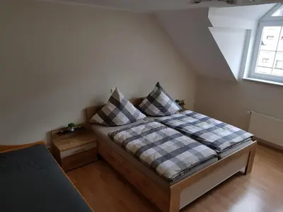 Ein Bett oder Betten in einem Zimmer der Unterkunft Fewo-am-Rotheschbach