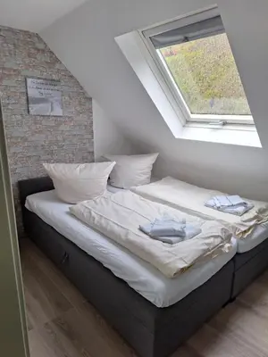 Ein Bett oder Betten in einem Zimmer der Unterkunft Ferienhaus Moselherz