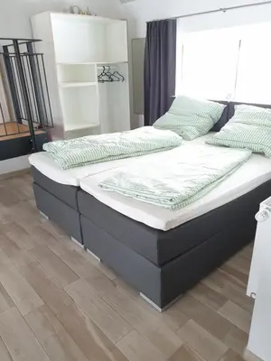 Ein Bett oder Betten in einem Zimmer der Unterkunft Beim Hooch 