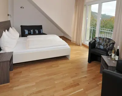 Ein Bett oder Betten in einem Zimmer der Unterkunft Gästehaus Wein im Turm