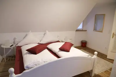 Ein Bett oder Betten in einem Zimmer der Unterkunft Cafe-Konditorei-Pension Sander