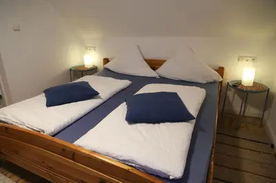 Ein Bett oder Betten in einem Zimmer der Unterkunft Cafe-Konditorei-Pension Sander