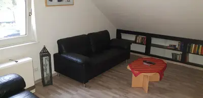 Ein Sitzbereich in der Unterkunft Ferienwohnung AM BACH