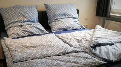 Ein Bett oder Betten in einem Zimmer der Unterkunft Beim Hooch 