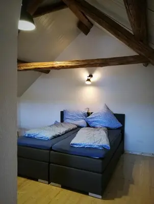 Ein Bett oder Betten in einem Zimmer der Unterkunft Beim Hooch 