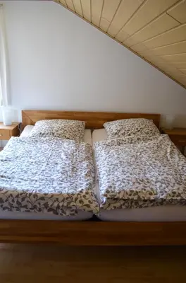Ein Bett oder Betten in einem Zimmer der Unterkunft Beim Hooch 
