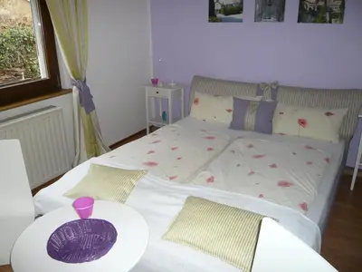 Ein Bett oder Betten in einem Zimmer der Unterkunft Pension am Weinberg