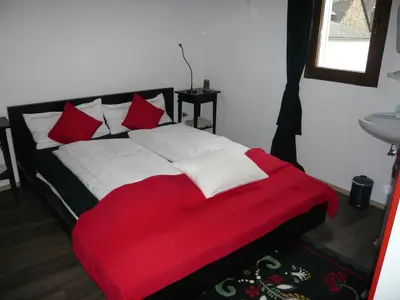 Ein Bett oder Betten in einem Zimmer der Unterkunft Pension am Weinberg