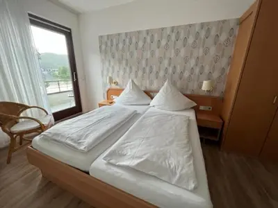 Ein Bett oder Betten in einem Zimmer der Unterkunft Hotel Haus Erholung