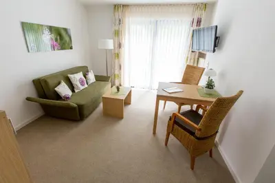 Ein Sitzbereich in der Unterkunft Hotel Haus Erholung