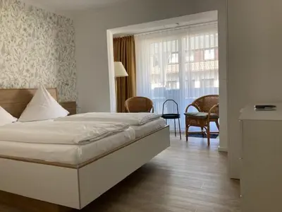 Ein Bett oder Betten in einem Zimmer der Unterkunft Hotel Haus Erholung
