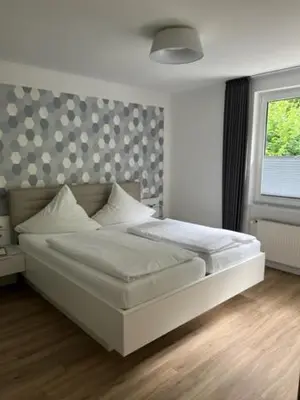 Ein Bett oder Betten in einem Zimmer der Unterkunft Hotel Haus Erholung