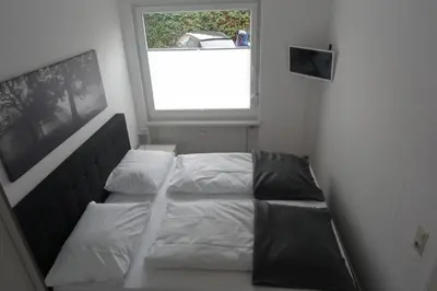 Ein Bett oder Betten in einem Zimmer der Unterkunft Niederwerth bei Koblenz