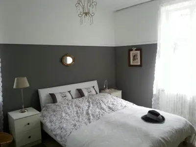 Ein Bett oder Betten in einem Zimmer der Unterkunft Das Rosenhaus